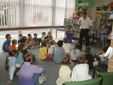 Steve Skidmore reading to the children.